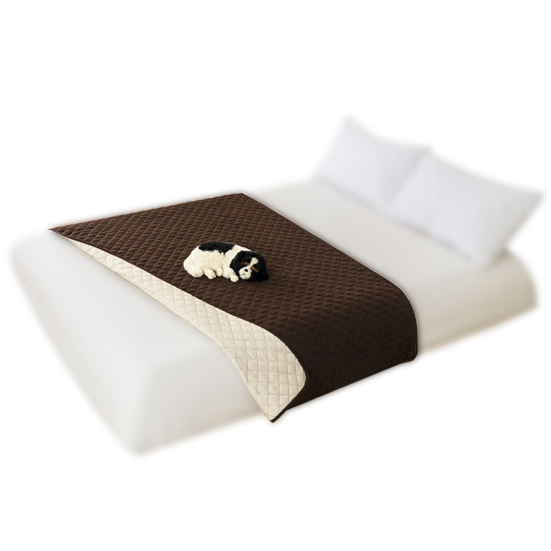 Sofa Cover, brown and cream reversible quilt on a bed