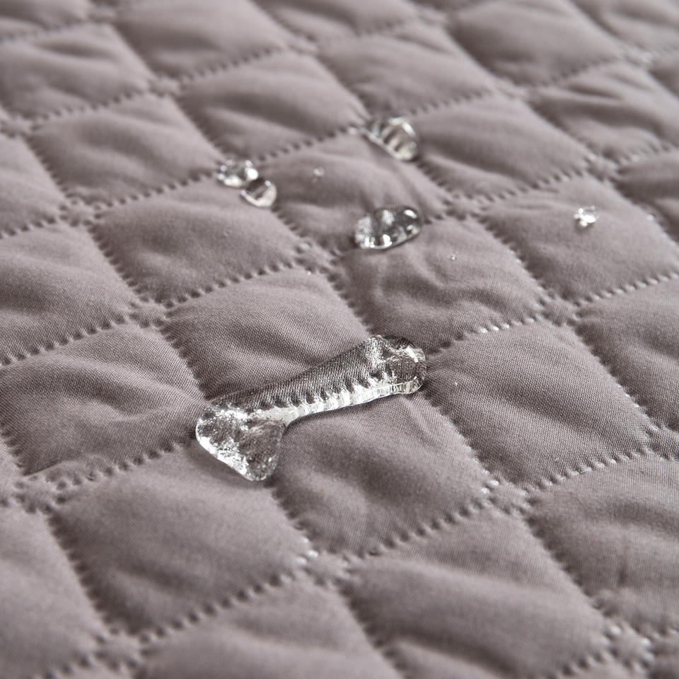 Sofa Cover quilt close-up with water beading