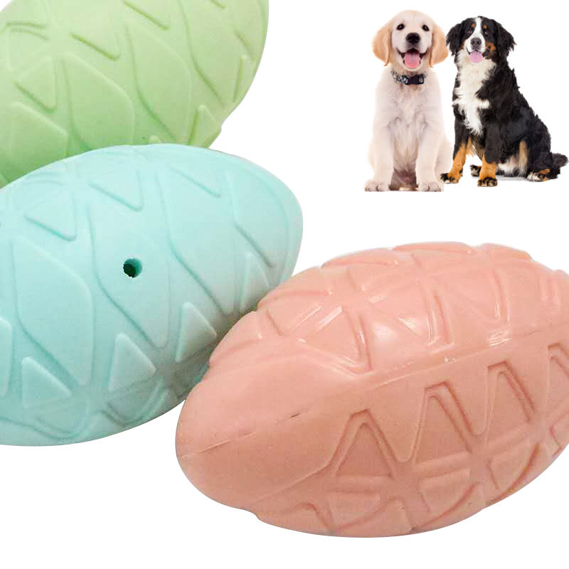 Three Squeak Egg colors with dogs for scale