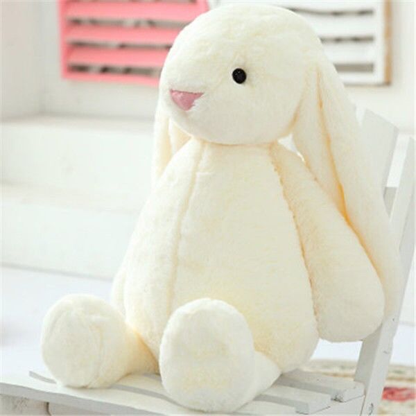 Cream Plush Bunny seated on a white chair