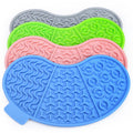 OrvelloGo lick mat in gray, green, pink, and blue stacked on white