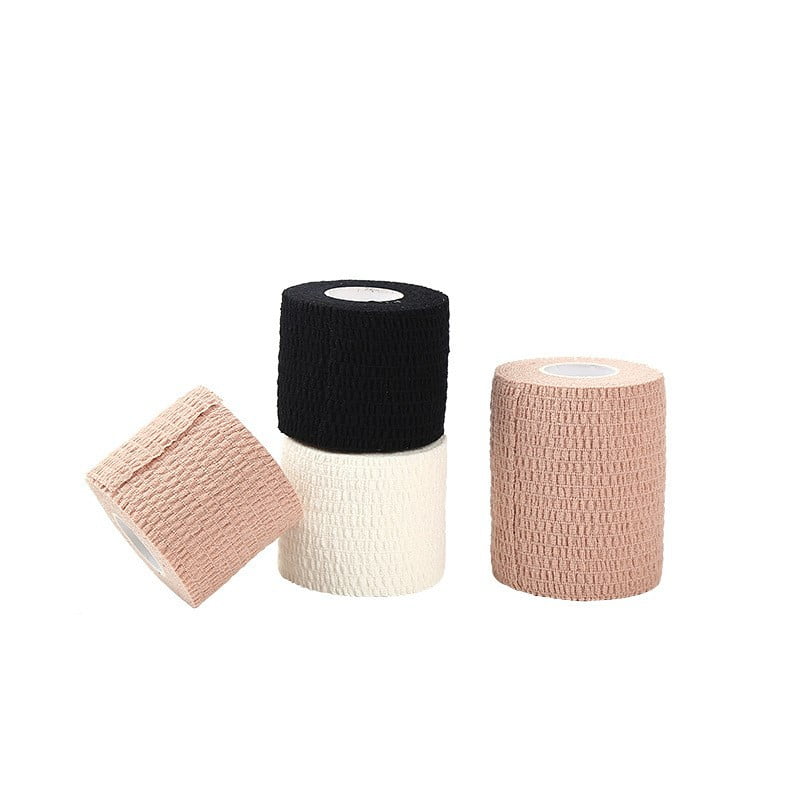 Vet Wrap rolls in black, white, and tan