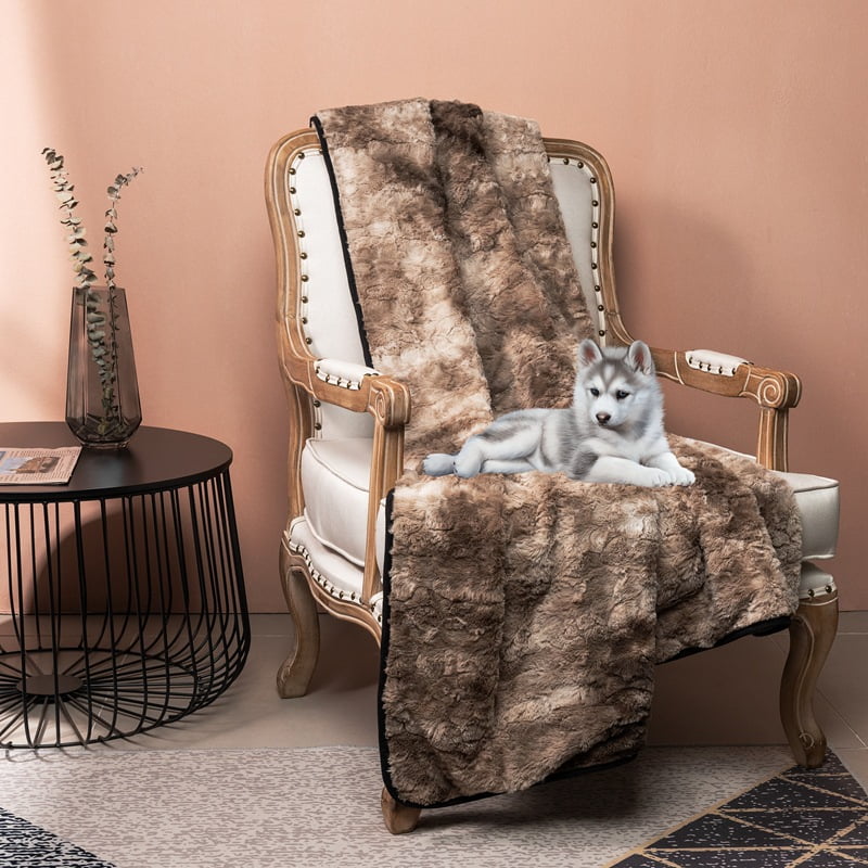 Fur Throw, mottled brown shag on a cream armchair