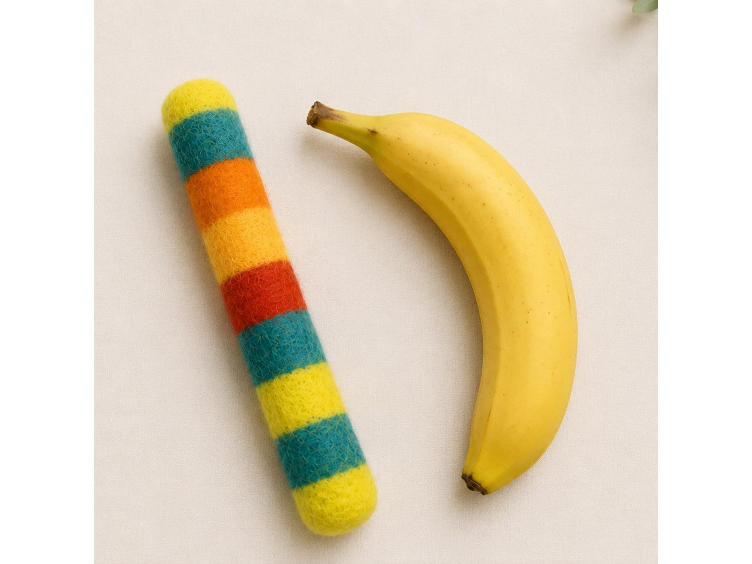 Felt Kicker next to a banana for scale
